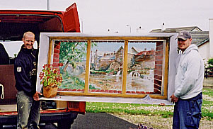 Carpenters carry the painting