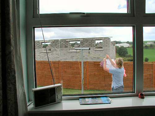 View of new construction from existing bungalow bedroom