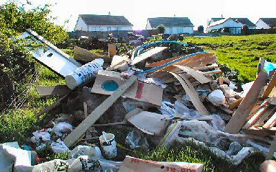 Dumped builders material, paint pots etc.